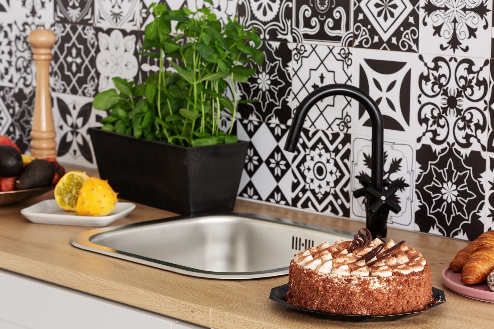 Cake Herbs and Fruits on Kitchen Counter